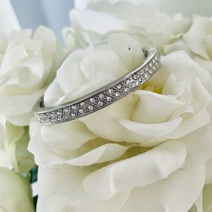 Silver tone with rhinestone detailing magnetic latch bracelet